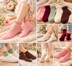 Pink ruffle socks worn with white sneakers and floral skirt