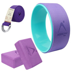 Yoga accessories set with purple and teal wheel, strap, and blocks on a white background